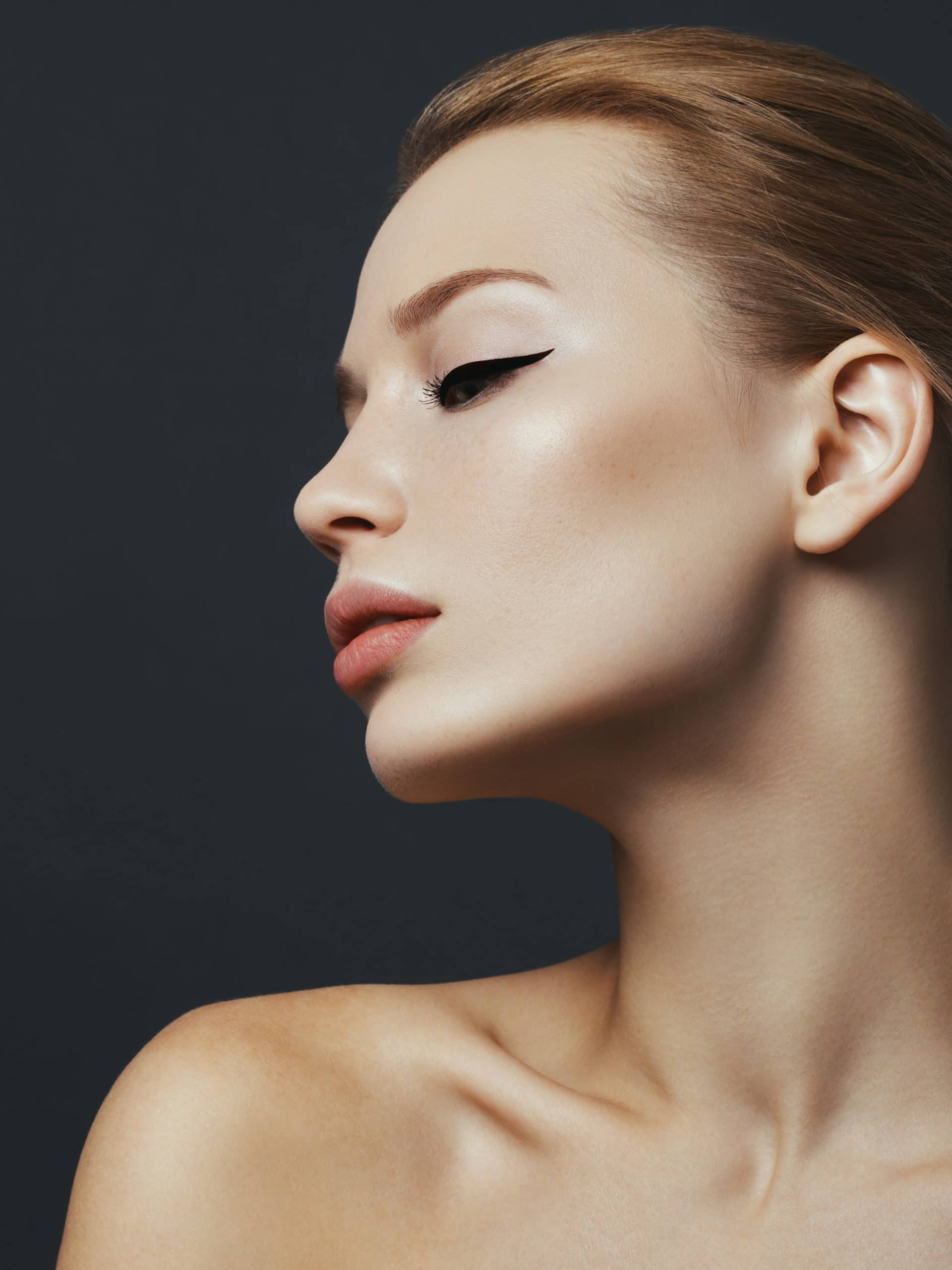 Portrait of a beautiful woman, showing neck and jawline