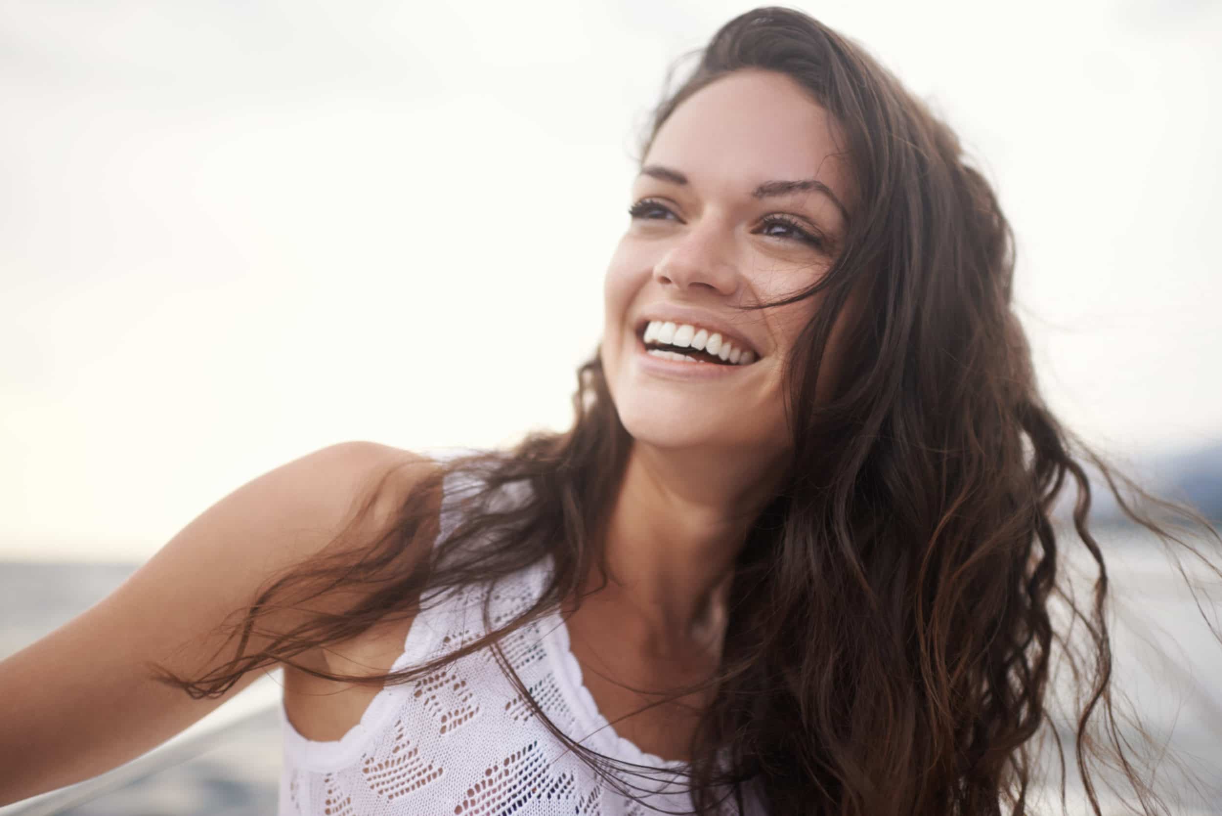 woman smiling after CoolSculpting