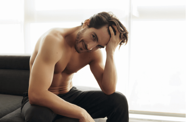 Shirtless White Man With Beautiful Hair is smiling and looking